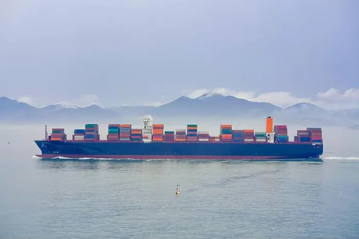 Framed Print : Cargo ship sailing on a foggy ocean with a tranquil mountain backdrop, Busan, Korea