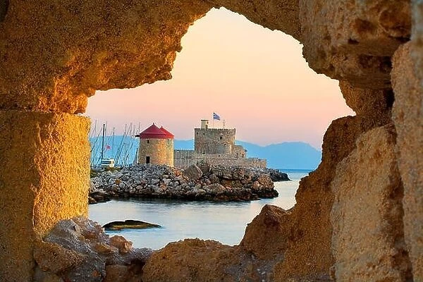 The Castle and old windmills at the enterance to Mandraki harbour in Rhodes, Greece, UNESCO
