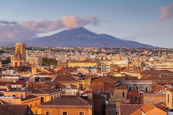 Catania, Sicily, Italy skyline with Mt. Etna at dusk