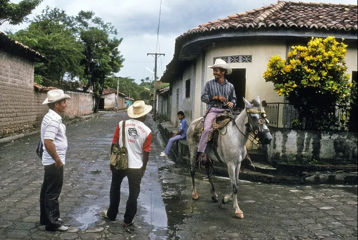 Framed Print : Cattle farmers passing through the village of Anamoros, El Salvador Framed Print : Cattle farmers passing through the village of Anamoros, El Salvador