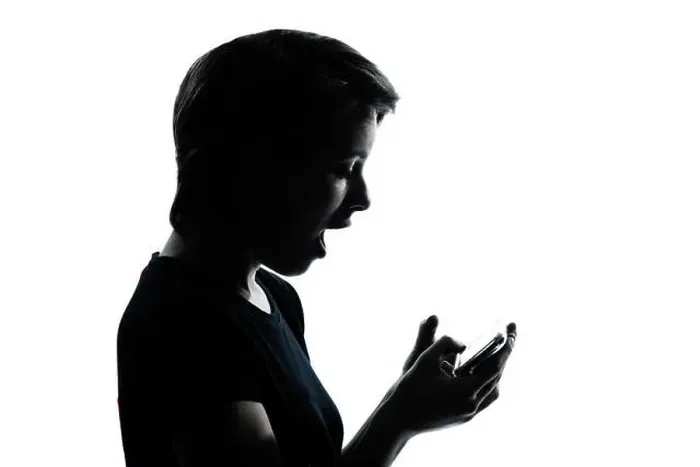 Framed Print : one caucasian young teenager silhouette girl telephone videophone video game portrait in studio cut out isolated Framed Print : one caucasian young teenager silhouette girl telephone videophone video game portrait in studio cut out isolated