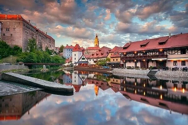 Cesky Krumlov. Cityscape image of downtown Cesky Krumlov, Czech Republic with reflection of the city in Vltava River at summer sunset