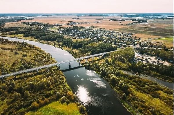Chachersk, Belarus. Aerial View Of Bridge over the Sozh river In Summer Day. Top View Of Beautiful European Nature From High Attitude In Summer Season