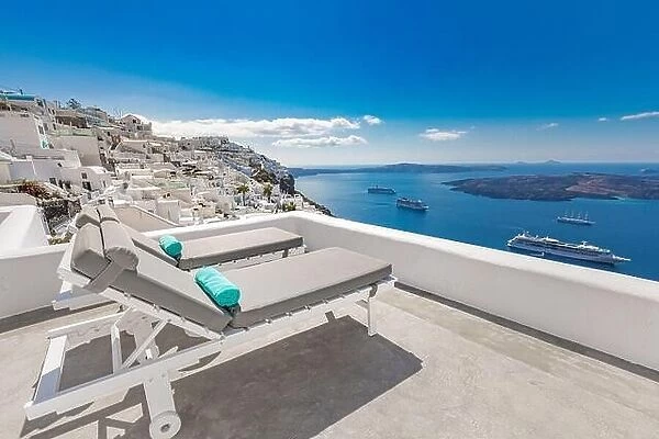 Chaise lounge in Santorini, Greece. Luxury summer travel landscape, vacation sea view. White architecture, relax over blue bay, cruise ships, resort