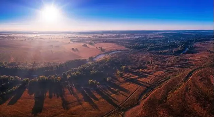 Framed Print : The channel and bends of the river, on a marshy meadow. Orange dry grass, scorched by the summer heat, and morning fog Framed Print : The channel and bends of the river, on a marshy meadow. Orange dry grass, scorched by the summer heat, and morning fog