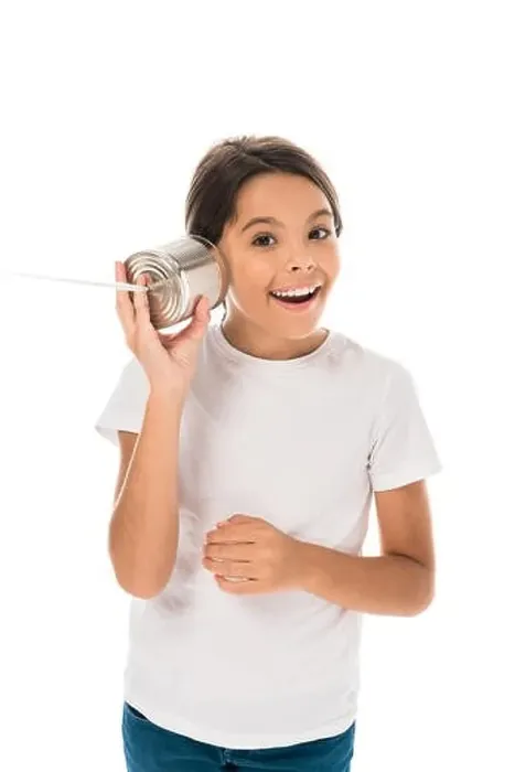 Framed Print : cheerful kid holding tin can near ear isolated on white