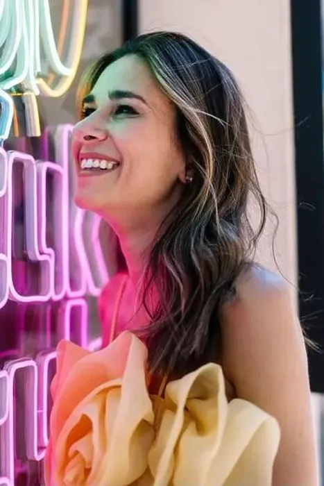 Framed Print : Cheerful young woman by illuminated neon lights Framed Print : Cheerful young woman by illuminated neon lights