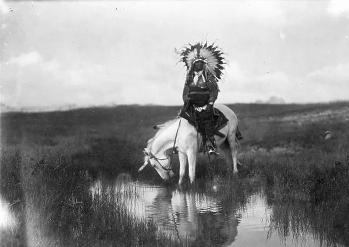 Framed Print : Cheyenne Indian, wearing headdress, on horseback, 1905. Photograph by Edward Curtis (1868-1952) Framed Print : Cheyenne Indian, wearing headdress, on horseback, 1905. Photograph by Edward Curtis (1868-1952)