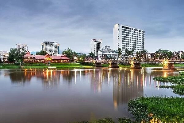 Chiang Mai, Thailand hotel skyline on the Ping River at dusk
