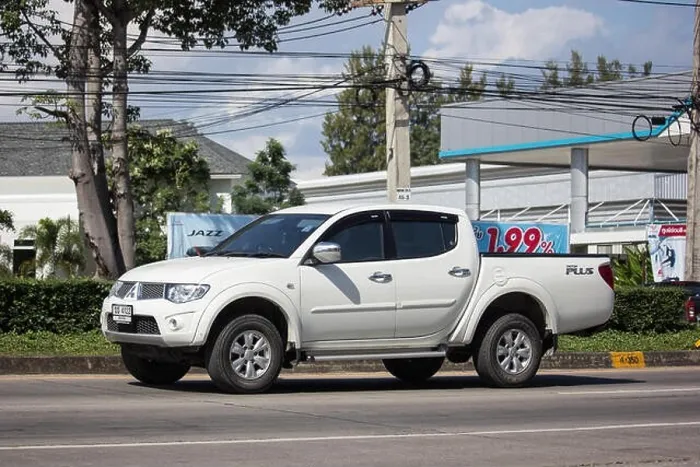Framed Print : Chiangmai, Thailand - November 15 2018: Private car, Mitsubishi Triton Pickup Truck. On road no.1001, 8 km from Chiangmai Business Area Framed Print : Chiangmai, Thailand - November 15 2018: Private car, Mitsubishi Triton Pickup Truck. On road no.1001, 8 km from Chiangmai Business Area