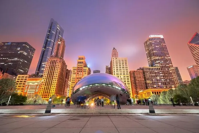 Framed Print : CHICAGO - ILLINOIS: MAY 12, 2018: Tourists visit Cloud Gate in Millennium Park in the evening Framed Print : CHICAGO - ILLINOIS: MAY 12, 2018: Tourists visit Cloud Gate in Millennium Park in the evening