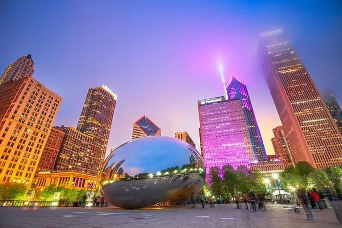 Framed Print : CHICAGO - ILLINOIS: MAY 12, 2018: Tourists visit Cloud Gate in Millennium Park in the evening Framed Print : CHICAGO - ILLINOIS: MAY 12, 2018: Tourists visit Cloud Gate in Millennium Park in the evening
