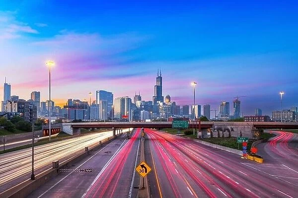 Chicago, Illinois, USA downtown skyline over highways at twilight