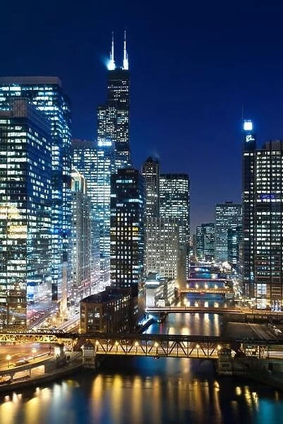 Chicago at night. Image of Chicago downtown and Chicago River with bridges at night