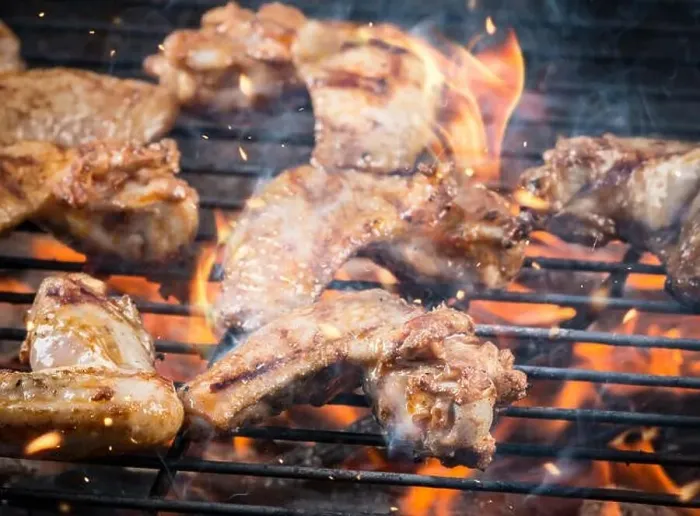 Framed Print : Chicken wings on barbecue grill with fire Framed Print : Chicken wings on barbecue grill with fire