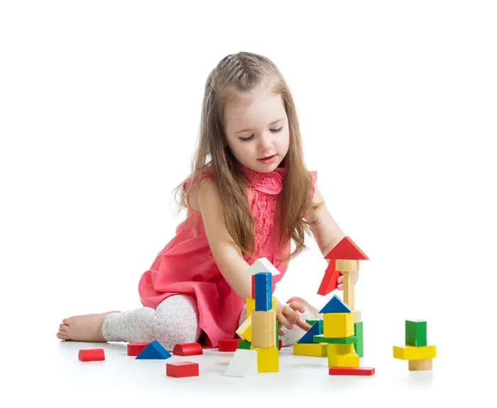 Framed Print : child girl playing with block toys over white background Framed Print : child girl playing with block toys over white background