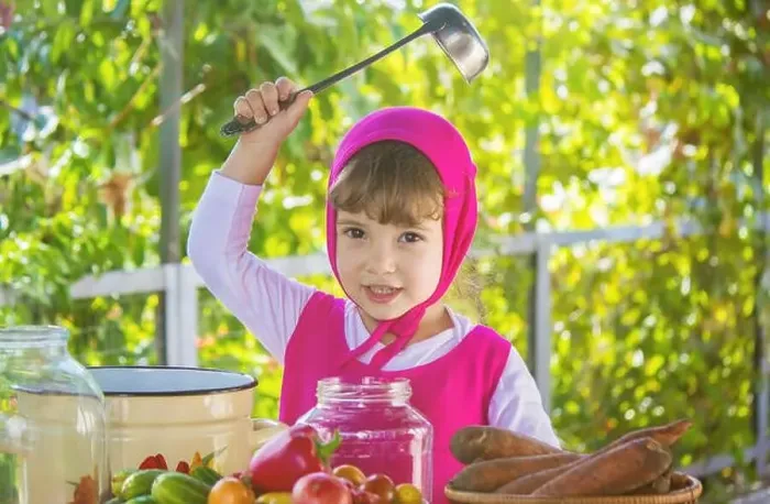 Framed Print : Child and vegetables. Selective focus Framed Print : Child and vegetables. Selective focus