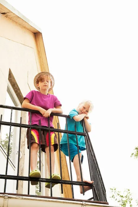 Framed Print : Children looking down from balcony Framed Print : Children looking down from balcony