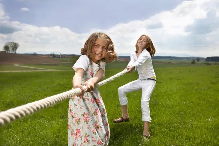 Framed Print : Children pulling a rope in countryside Framed Print : Children pulling a rope in countryside