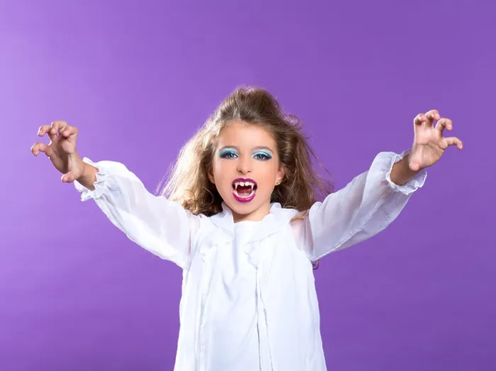 Framed Print : Children vampire makeup kid girl on purple background Framed Print : Children vampire makeup kid girl on purple background