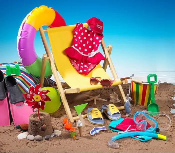 Framed Print : Child's bucket and spade, flippers, deckchair and various other seaside holiday items on beach Framed Print : Child's bucket and spade, flippers, deckchair and various other seaside holiday items on beach