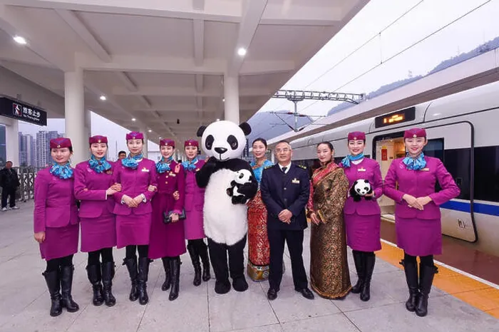 Framed Print : Chinese train attendants pose with a worker dressed in giant panda costumes in front of a CRH (China Railway High-speed) Framed Print : Chinese train attendants pose with a worker dressed in giant panda costumes in front of a CRH (China Railway High-speed)