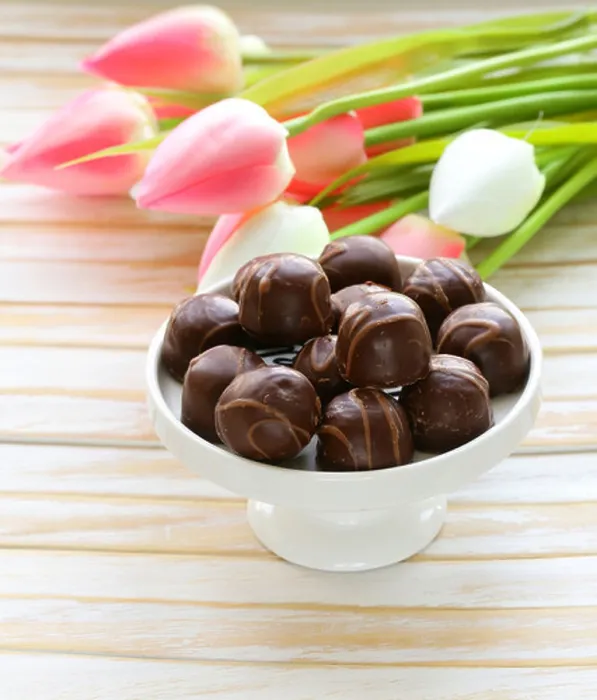 Framed Print : chocolate candy and flowers on white background Framed Print : chocolate candy and flowers on white background