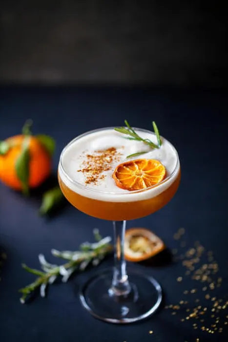 Framed Print : Christmas cocktail of amaretto sour with dehydrated clementine and rosemary Framed Print : Christmas cocktail of amaretto sour with dehydrated clementine and rosemary