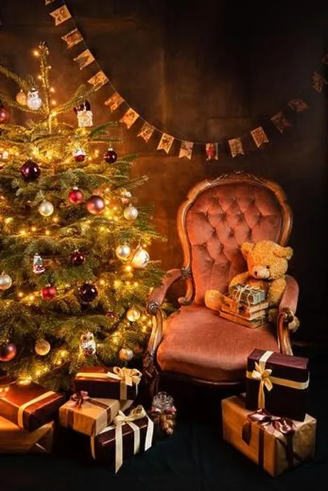 Framed Print : Christmas tree with decorations, vintage old armchair with toys and books, piles of presents, postcard concept Framed Print : Christmas tree with decorations, vintage old armchair with toys and books, piles of presents, postcard concept