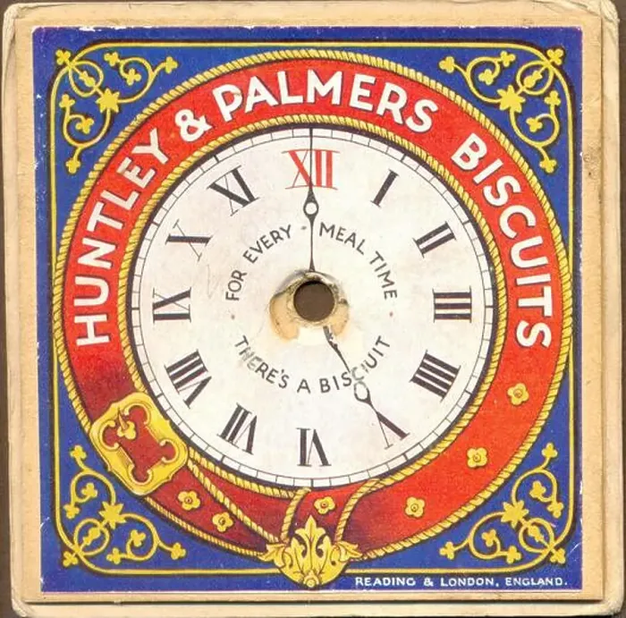 Framed Print : Chromolithographed advertising give away for Huntley & Palmers Biscuits circa 1895 showing a clock face with moveable Framed Print : Chromolithographed advertising give away for Huntley & Palmers Biscuits circa 1895 showing a clock face with moveable