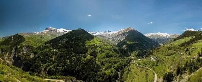 Framed Print : church in a village in the french alps with mountains 3000 meters high. Green meadows in spring. drone panning Framed Print : church in a village in the french alps with mountains 3000 meters high. Green meadows in spring. drone panning