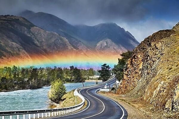 The Chuysky Trakt one of the most beautiful mountain roads of the world, Chuya river and rainbow over road