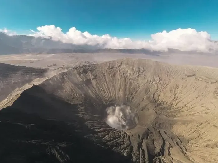 Framed Print : Cinematic shot aerial view of Mount Bromo crater with active volcano smoke in East Java Framed Print : Cinematic shot aerial view of Mount Bromo crater with active volcano smoke in East Java