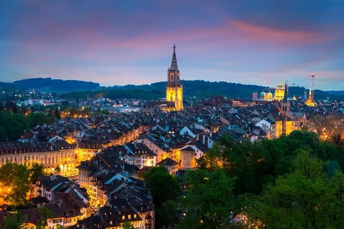 Framed Print : City of Bern skyline with a dramatic sky in Bern, Switzerland Framed Print : City of Bern skyline with a dramatic sky in Bern, Switzerland