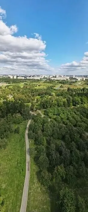 Framed Print : City landscape. Nearby there is a park area. Blue sky with white clouds. Aerial photography of the panorama Framed Print : City landscape. Nearby there is a park area. Blue sky with white clouds. Aerial photography of the panorama