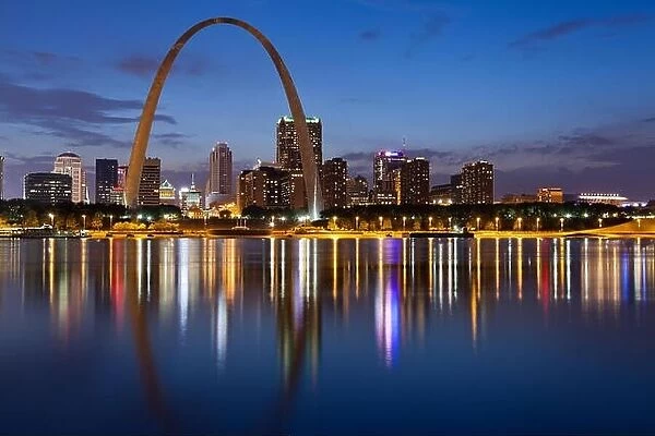 City of St. Louis skyline. Image of St. Louis downtown with Gateway Arch at twilight