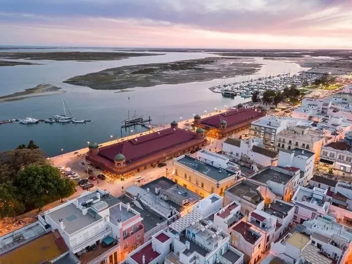 Framed Print : City view with two market buildings and and river Ria Formosa in the evening Framed Print : City view with two market buildings and and river Ria Formosa in the evening
