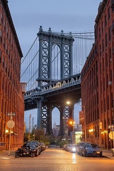Cityscape of Manhattan Bridge from Brooklyn in New York City at twilight