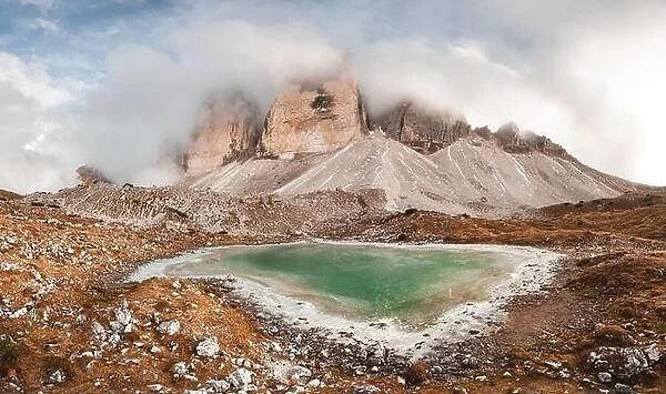 Clear turquoise water of alpine lake Rienzquelle in the Tre Cime Di Laveredo National Park, Dolomites, Italy