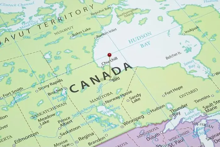 Framed Print : Close up to a Bird city with a red pin needle into Canada country political map Framed Print : Close up to a Bird city with a red pin needle into Canada country political map