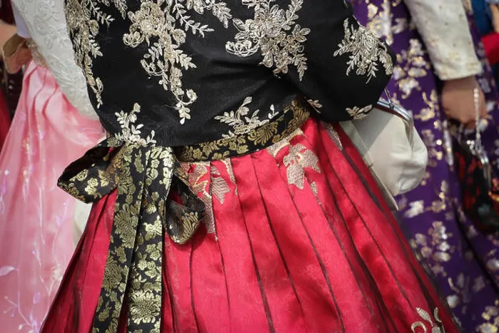 Framed Print : Close up of a bright red pleated chima or wrap-around skirt Framed Print : Close up of a bright red pleated chima or wrap-around skirt
