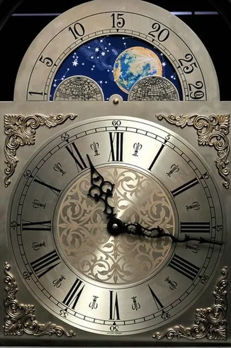 Framed Print : Close up of the clock face of a grandfather clock including a moon dial showing the phases of the moon Framed Print : Close up of the clock face of a grandfather clock including a moon dial showing the phases of the moon