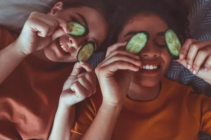 Framed Print : Close up above photo of two best girlfriends spending time together having fun while applying cucumber slices on eyes Framed Print : Close up above photo of two best girlfriends spending time together having fun while applying cucumber slices on eyes