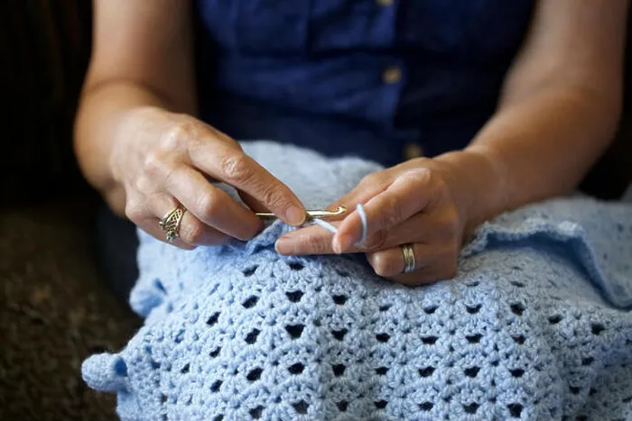 Framed Print : Close up picture of a Caucasian woman crocheting at home Framed Print : Close up picture of a Caucasian woman crocheting at home