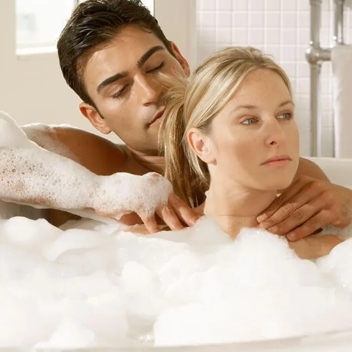 Framed Print : Close-up of a young couple in a bubble bath Framed Print : Close-up of a young couple in a bubble bath