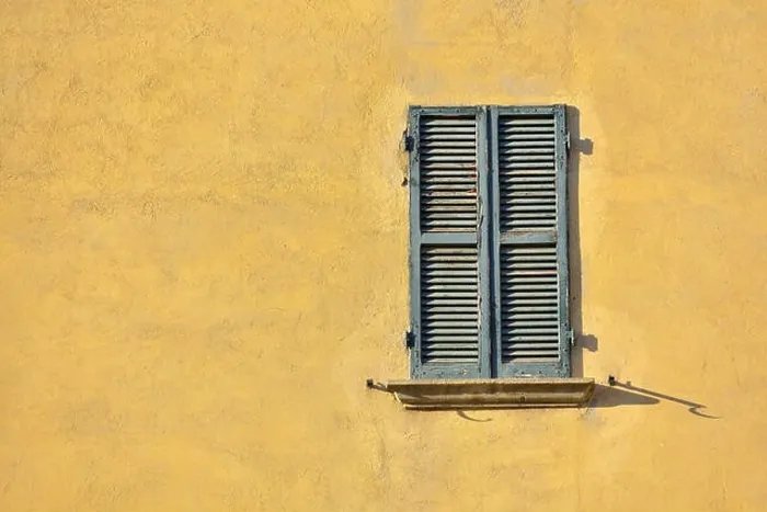 Framed Print : Closed green windows on yellow wall of old house in Florence city, Italy