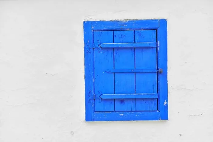 Framed Print : Closed vintage blue window on white wall of old house in romania Framed Print : Closed vintage blue window on white wall of old house in romania