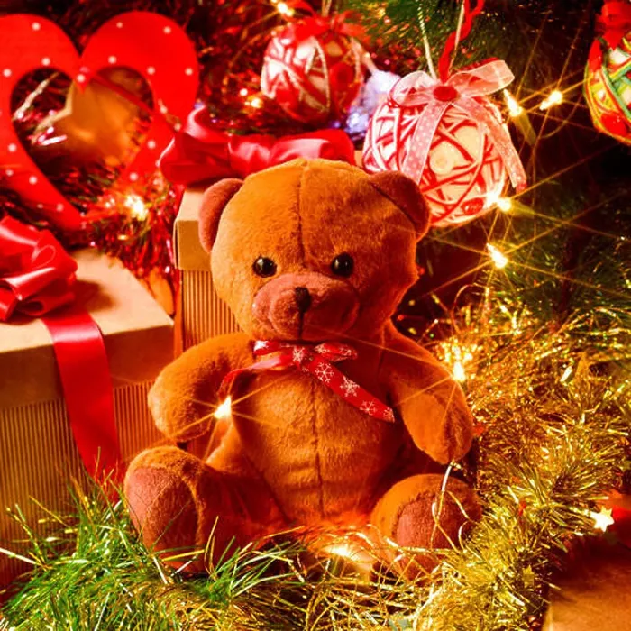 Framed Print : closeup of a brown teddy bear and some gifts under a christmas tree ornamented with lights, balls and tinsel Framed Print : closeup of a brown teddy bear and some gifts under a christmas tree ornamented with lights, balls and tinsel