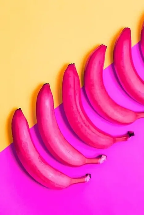 Framed Print : Closeup of pink bananas on purple and yellow background, top view. Abstract, creative, creativity concept Framed Print : Closeup of pink bananas on purple and yellow background, top view. Abstract, creative, creativity concept