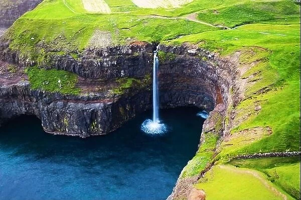 Closeup view of Mulafossur waterfall in Gasadalur village, Vagar Island of the Faroe Islands, Denmark. Landscape photography